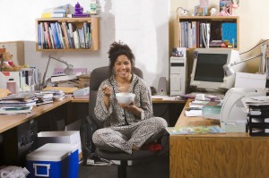 woman working in pajamas at home office